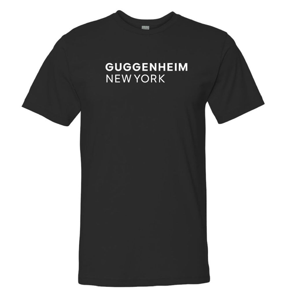 The Guggenheim New York T-Shirt is a black tee with bold, white uppercase “GUGGENHEIM NEW YORK” lettering on the chest—perfect for fans of this iconic landmark and modern design.
