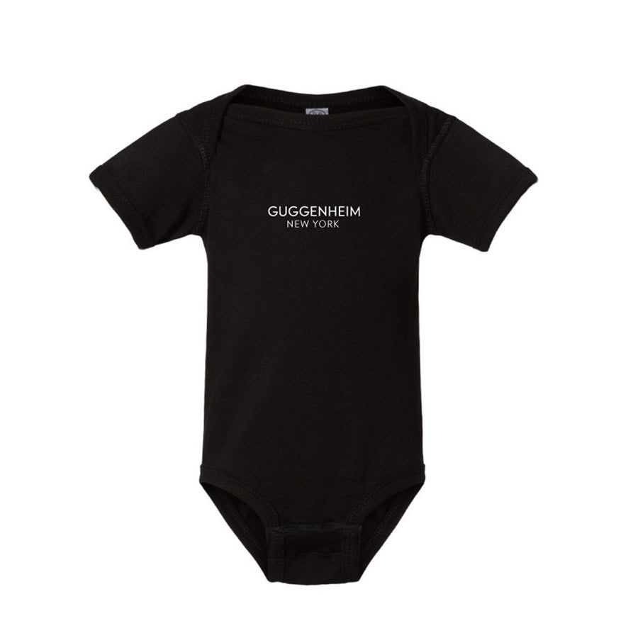 The Guggenheim New York Onesie is a black, short-sleeve baby bodysuit featuring "Guggenheim New York" in white text on the chest, inspired by the iconic museum’s minimalist design.