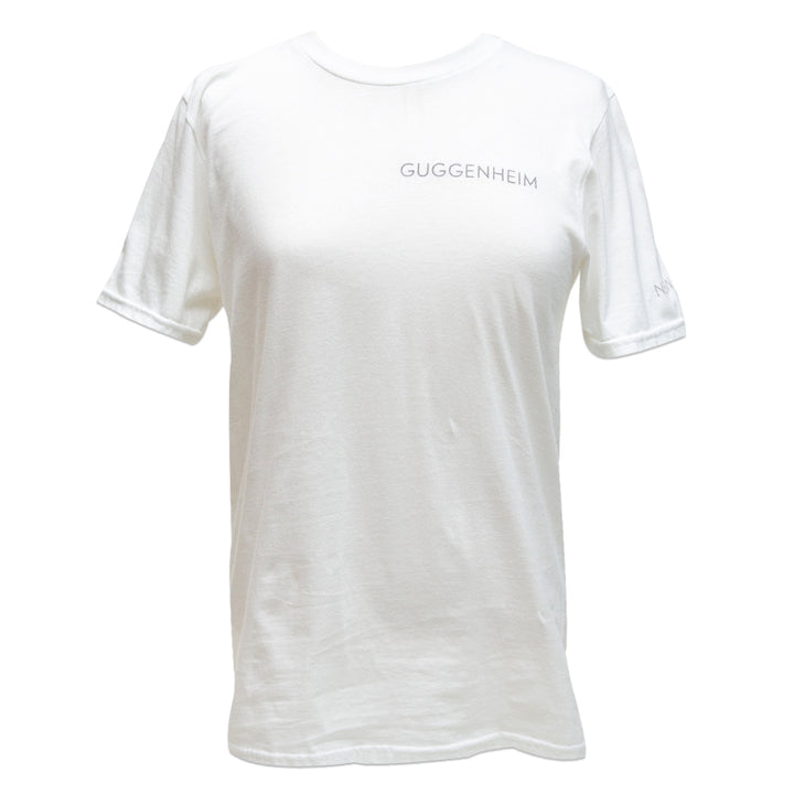 The Guggenheim Rotunda Tee is a unisex white cotton shirt with the Guggenheim Logo in small, light gray print on the upper left chest, shown against a white background.
