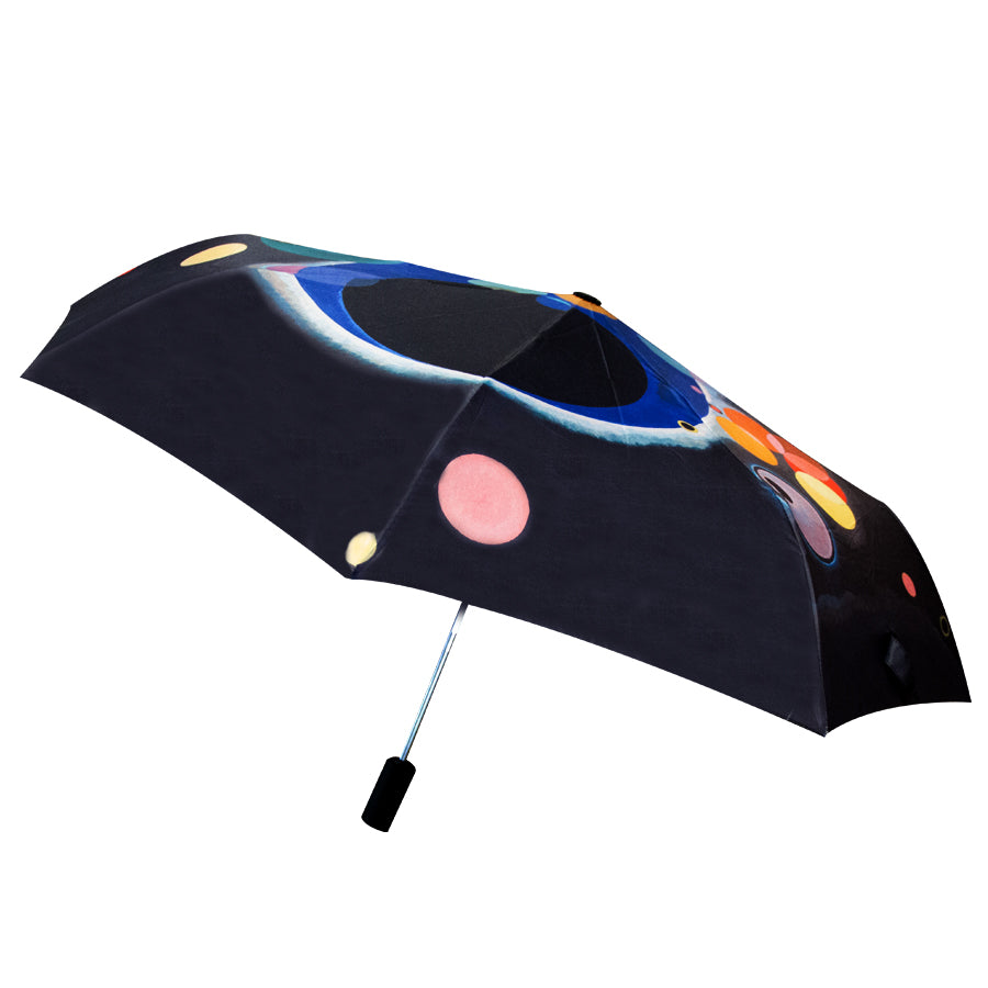 The Kandinsky Umbrella, Several Circles features a black canopy with bold, abstract circular shapes in blue, pink, orange, and yellow—evoking artwork inspired by Kandinsky and reminiscent of pieces from the Guggenheim Museum.