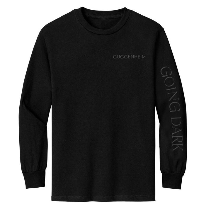 A modern artist staple, the Guggenheim Going Dark Logo Long Sleeve T-Shirt features small gray “GUGGENHEIM” text on the chest and bold “GOING DARK” lettering down the right sleeve in classic black.