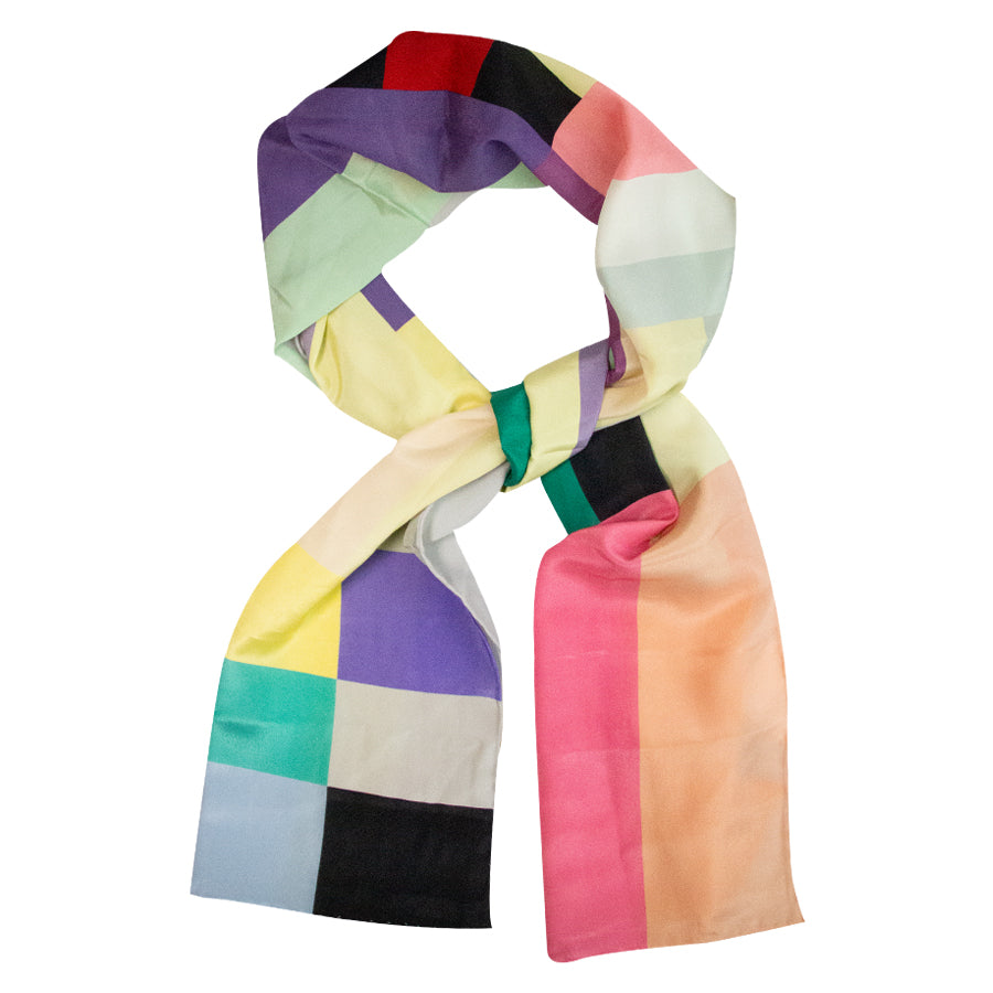 The Kandinsky Scarf, Yellow Painting, features a vibrant patchwork of squares and rectangles inspired by the Guggenheim Museum, displayed elegantly against a white background.